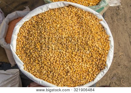 Burlap, Bag Full Of Arhar Or Masoor Dhal Or Toor Dal Pigeon Pea. Concept For Earnings Or Spend In Ag