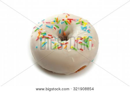 Sweet Doghnut In White Glaze Decorated With Sprinkles Isolated On A White Background