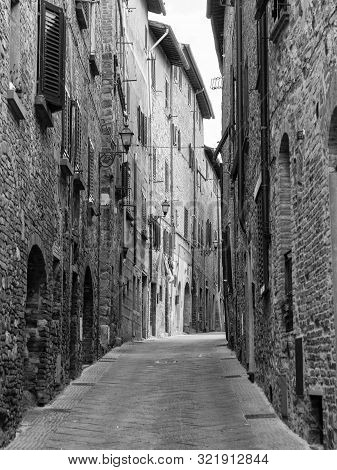 Gambassi Terme, Florence, Tuscany, Italy: Buildings Of The Medieval City. Street. Black And White