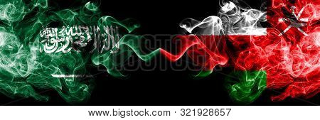 Saudi Arabia Kingdom Vs Oman, Omani Smoky Mystic Flags Placed Side By Side. Thick Colored Silky Smok