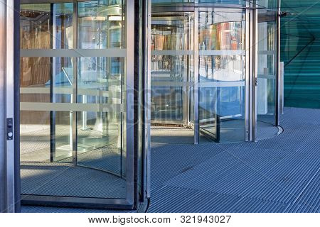 Automatic Revolving Doors At Modern Building Entrance