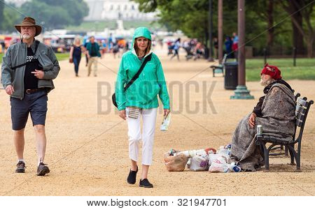 Washington Dc, Usa - June 9, 2019: Visitors To Dc Go For A Stroll Along The National Mall. A Homeles