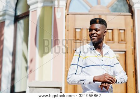 Portrait Of Handsome Stylish African American Model Man In Red Throusers And White Shirt.