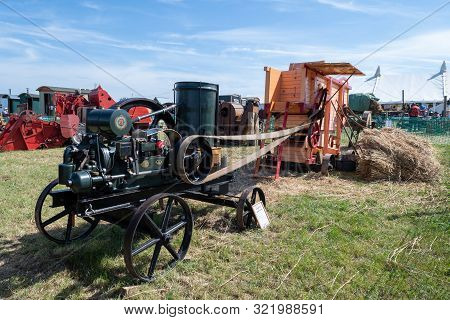 Blandford Forum.dorset.united Kingdom.august 24th 2019.a Threshing Machine Is Being Driven By An Ant