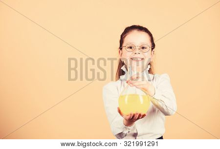 Small Smart Girl With Testing Flask. Education And Knowledge. Child Study Bilogy Lesson. Science Res