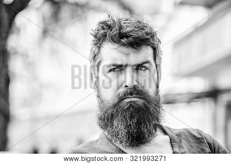Brutal Male Needs Barber. Bearded Man Feel Loneliness. Thoughtful Man Outdoor. Facial Skin Care. Wai