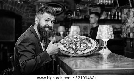 Hipster Client Sit At Bar Counter. Man Received Delicious Pizza. Enjoy Your Meal. Cheat Meal Concept