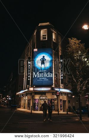 London, United Kingdom - August 31, 2019: Illuminated Facade Of Cambirdge Theatre Located On Seven D