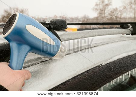 Icy Car Body And A Door That Cannot Be Opened After Freezing Rain. Warming Up Using Hairdryer. Probl
