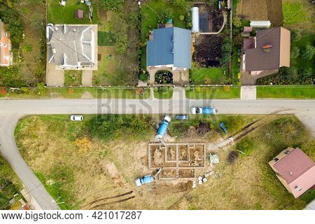 Top Down Aerial View Of Construction Works Of New House Concrete Foundation In Rural Residential Are