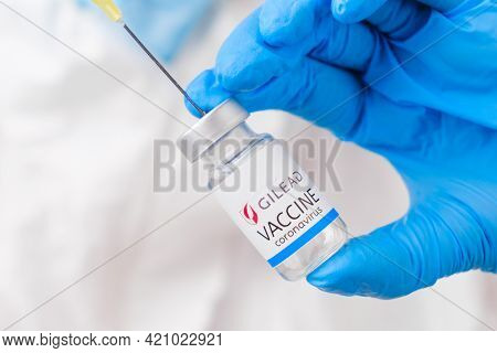 Gilead Vaccine Against Coronavirus Collected Into The Syringe By Health Worker Or Doctor In Protecti