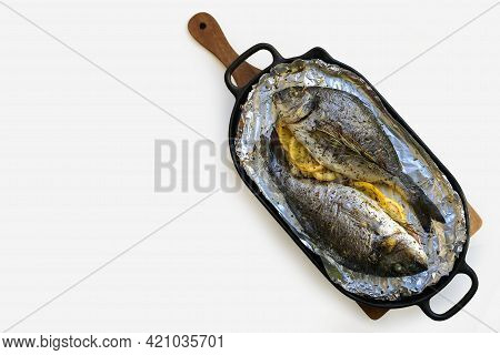 Mediterranean Diet. Baked Gilthead With Lemon And Herbs. Baked Dorada On A Pan. Dorada Grill. Proper