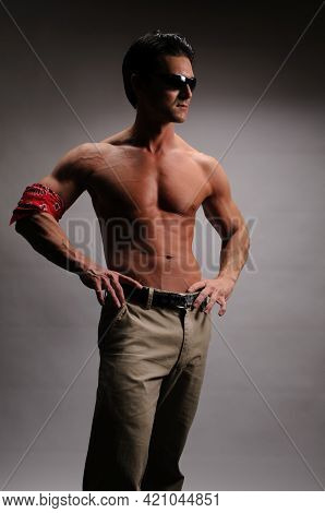 The Sexy Man Poses For The Photo Without A Shirt On.