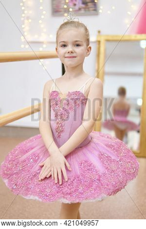 Little ballerina training. Children dance ?lassical ballet in studio.