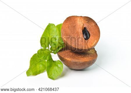 Sapodilla Fruit With Green Leaves Isolated On A White Background
