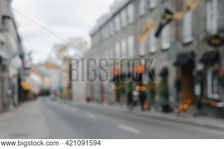 Lurred Abstract Image Of Old Town Street With Colorful Buildings And Bokeh Lights Background
