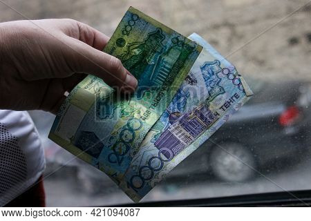 Azerbaijan, Baku - Nowember 2009: Man Hand With Manat Isolated On Black Background, Hand Holding Out