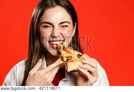 Smiling Happy Brunette Girl Eating Pizza With Satisfaction. Female Student Grab Bite Of Takeaway Ord