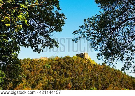 Landscape View Of Ruins Of Ancient Kremenets Castle On The Top Of The Hill. Tree Leaves Border. Natu
