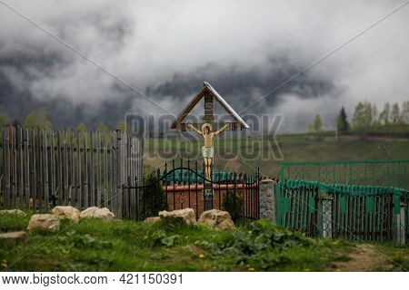 Pestera, Romania - May 14, 2021: Christian Orthodox Shrine (cross) With Jesus Christ As A Funeral Sy