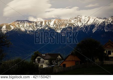 Heavy Clouds Over The Bucegi Mountains In Romania During A Spring Day, As Seen From The Hills Of Pes