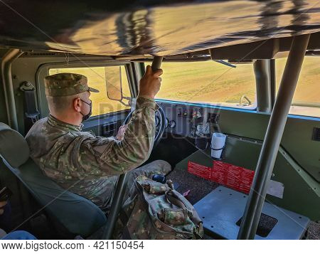 Smardan, Romania - May 11, 2021: Romanian Soldier Driving An Uro Vamtac Armored Vehicle.