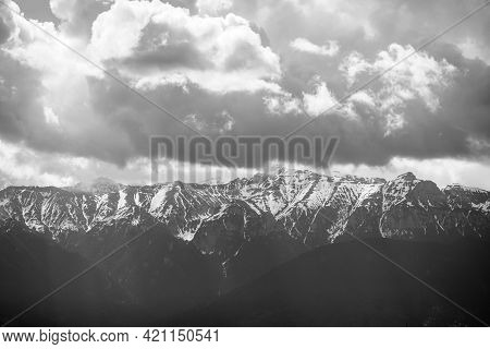 Heavy Clouds Over The Bucegi Mountains In Romania During A Spring Day, As Seen From The Hills Of Pes