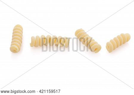 Uncooked Fusilli Corti Bucati Pasta Isolated On White Background. Close Up