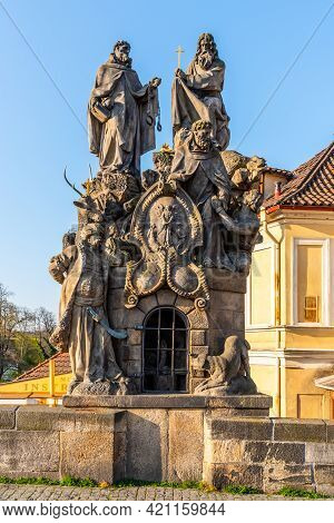 Statue Of John Of Matha, Felix Of Valois And Saint Ivan On Charles Bridge In Prague, Czech Republic