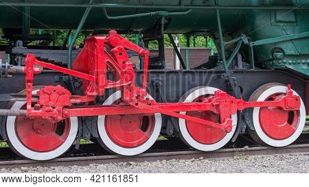 Red And White Iron Wheel Set With Coupling Rod (side Rod) Of The Old Retro Steam Locomotive Close Up