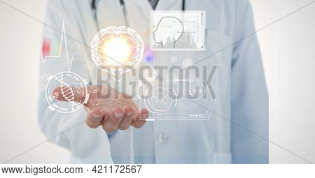 Composition of male doctor holding screen with medical data processing. global medicine and healthcare concept digitally generated image.