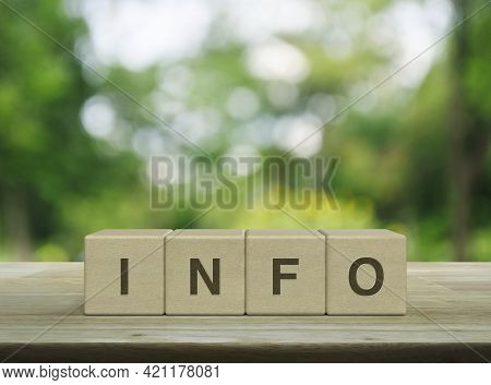 Info Letter On Block Cubes On Wooden Table Over Blur Green Tree In Park, Business Customer Service A