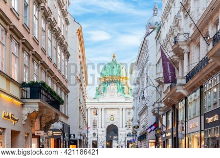 Vienna, Austria - April 2019: Kohlmarkt Shopping Street With Hofburg Palace At Background
