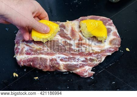 Homemade Capicola (coppa). Dry-cured Pork Loin Step-by-step Recipe. A Hand Squeezes Freshly Squeezed