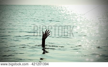 Dramatic Scene With The Open Hand Of The Unfortunate Castaway Who Is About To Drown In The Sea With 