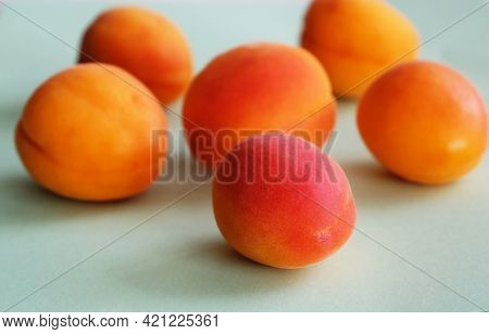 Apricots On A Soft Blue Green Background, Close-up