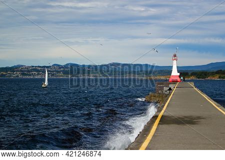 Lighthouse And Breakwater At Ogden Point In Victoria, British Columbia, Canada