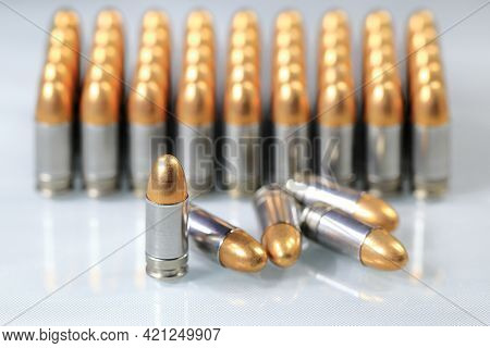 Pack Of Bullet 9mm Parabellum Fmj (full Metal Jacket ) On Reflection Surface With Shallow Focus.