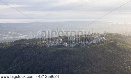 Aerial View Of Burnaby Mountain During A Vibrant Sunset. Taken In Greater Vancouver, British Columbi