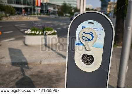 Warsaw. Poland - August 2015: Charging Station For An Electric Car In The City Center Against The Ba