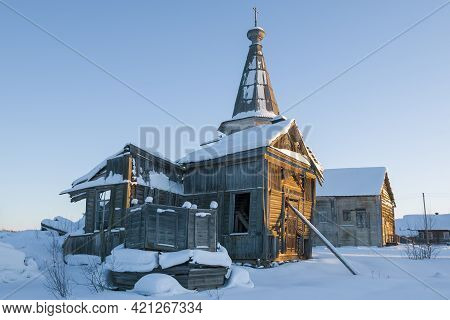Ruins Of Ancient Wooden Church Of The Tikhvin Icon Of The Mother Of God On February Evening. Saminsk