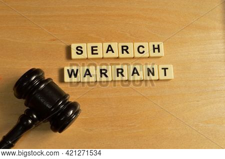 Top View Of Judge Gavel And Alphabet Letters With Text Search Warrant.