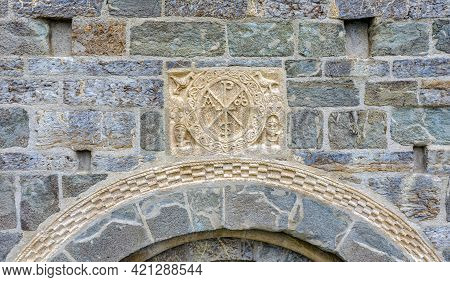 Roman Church Of Santa Maria De La Asuncion In Coll, Catalonia - Spain. Detail Of The Cristogram On T