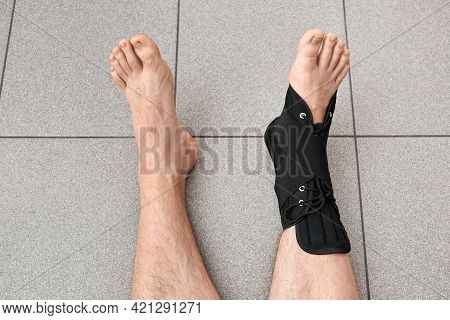 The Male Leg Is Fixed In A Medical Bandage. Ankle Fracture Or Sprain. Lacing And Tight Fit Of The Fo