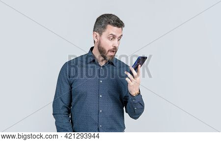 Surprised Mature Man Businessman With Beard Looking On Phone, Surprise