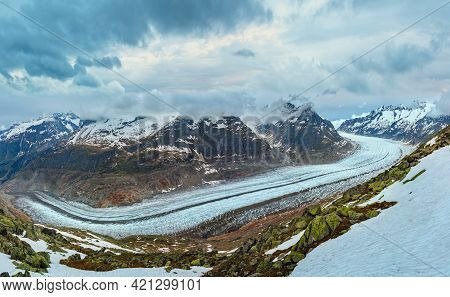 Great Aletsch Glacier And Ice Fall Summer Cloudy Panorama. Bettmerhorn, Switzerland, Alps Mountains.