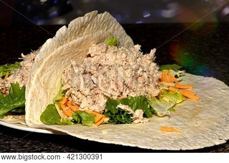 Close up of a freshly made tuna wrap.