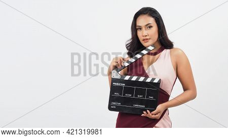 Asian Woman Hold Black Clapper Board Or Movie Slate Isolated On White Background.she Have Tan Skin ,
