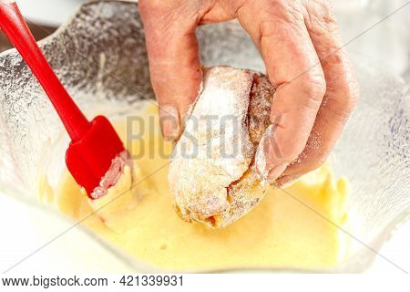 Senior Woman Preparing A Traditional Dish From El Valle Del Cauca In Colombia Called Aborrajado