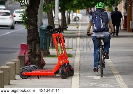 Bucharest, Romania - May 19, 2021: Several Lime-s Electric Scooters Are Parked On A Sidewalk Near A 